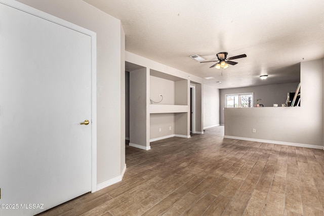 5482 S Monrovia Ave, Tucson, AZ 85706 - unfurnished living room with a ceiling fan and wood finished floors