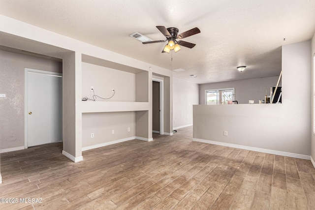 5482 S Monrovia Ave, Tucson, AZ 85706 - unfurnished living room featuring wood finished floors and ceiling fan