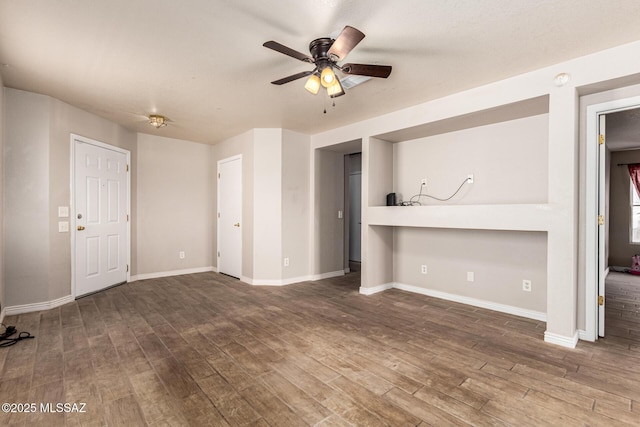 5482 S Monrovia Ave, Tucson, AZ 85706 - unfurnished living room featuring ceiling fan and wood finished floors