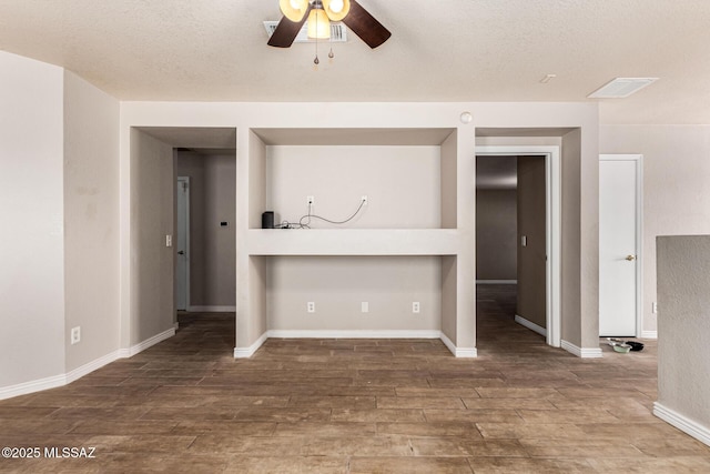 5482 S Monrovia Ave, Tucson, AZ 85706 - unfurnished living room with a ceiling fan, wood finished floors, and a textured ceiling