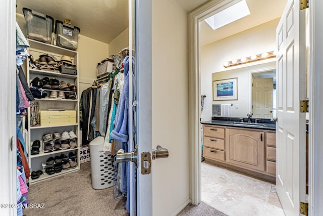 1148 W Circulo Del Norte, Green Valley, AZ 85614 - walk in closet featuring a skylight and light carpet