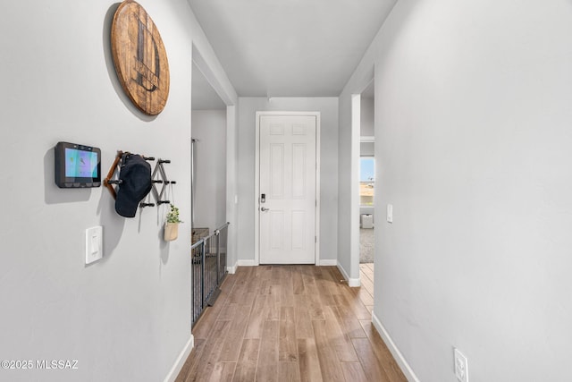 13331 N Carbine Ct, Marana, AZ 85653 - hallway with light wood finished floors and baseboards