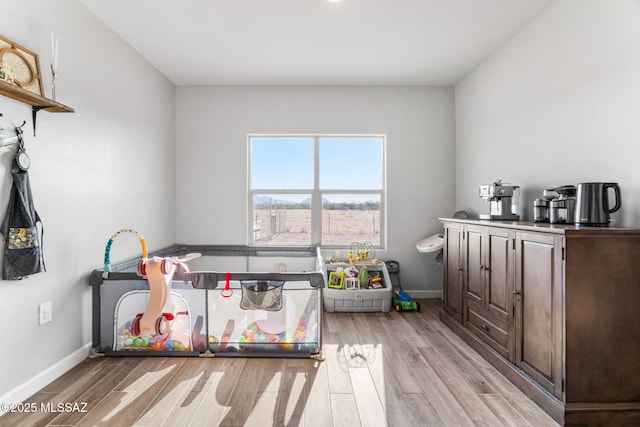 13331 N Carbine Ct, Marana, AZ 85653 - rec room with light wood-style floors and baseboards