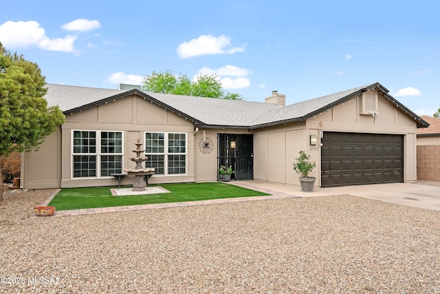 2730 W Calle Del Tigre, Tucson, AZ 85746 - single story home with a garage, driveway, a chimney, and roof with shingles