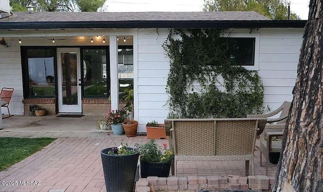 2602 E Prince Rd, Tucson, AZ 85716 - doorway to property with a patio and roof with shingles