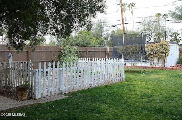 2602 E Prince Rd, Tucson, AZ 85716 - fenced backyard with a trampoline and a storage unit