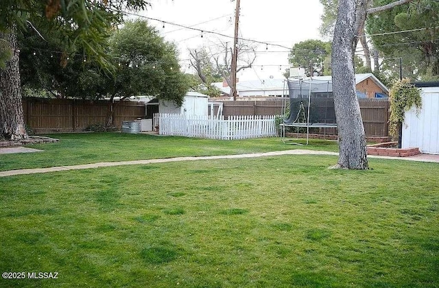 2602 E Prince Rd, Tucson, AZ 85716 - fenced backyard featuring a shed and a trampoline