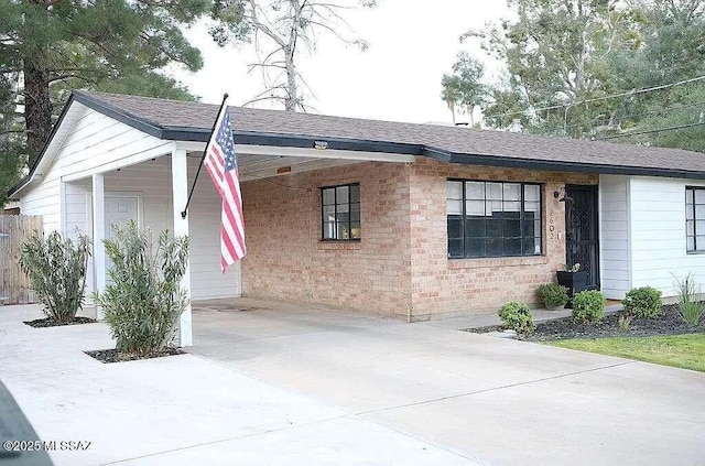 2602 E Prince Rd, Tucson, AZ 85716 - view of front of property with an attached carport, driveway, and a shingled roof