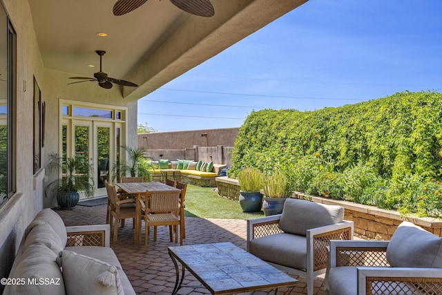 3923 S Camino Ensenada Del Pantano, Tucson, AZ 85730 - view of patio with an outdoor living space with a fire pit and a ceiling fan