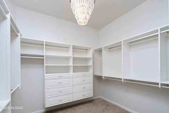 3923 S Camino Ensenada Del Pantano, Tucson, AZ 85730 - spacious closet featuring carpet flooring and a chandelier