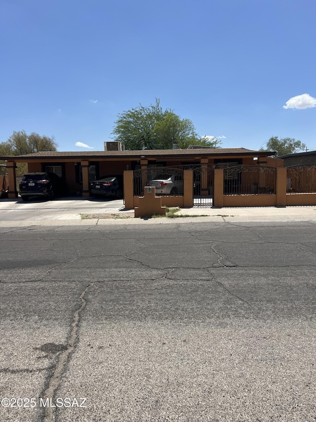 5119 S Aleppo Dr, Tucson, AZ 85706 - single story home with a fenced front yard, a carport, and concrete driveway