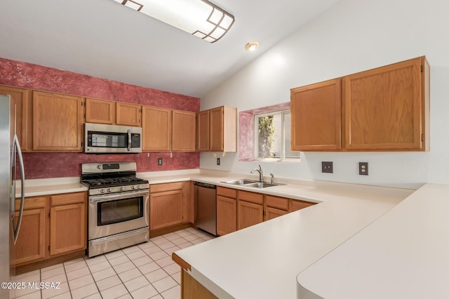 8410 E Heath Ct, Tucson, AZ 85715 - kitchen featuring stainless steel appliances, a peninsula, light countertops, light tile patterned floors, and lofted ceiling