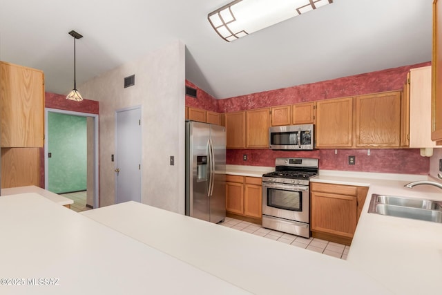 8410 E Heath Ct, Tucson, AZ 85715 - kitchen featuring stainless steel appliances, light tile patterned flooring, light countertops, vaulted ceiling, and pendant lighting