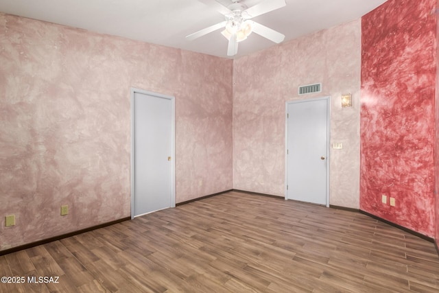 8410 E Heath Ct, Tucson, AZ 85715 - unfurnished room featuring a ceiling fan and wood finished floors