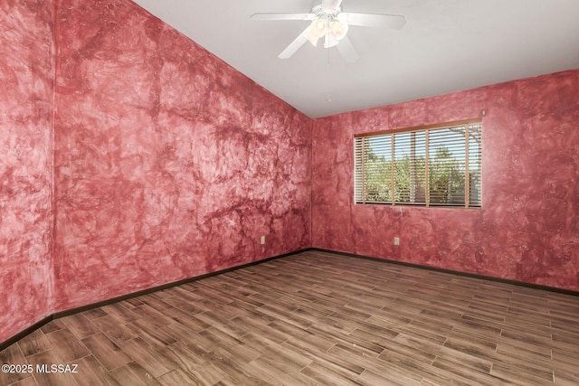 8410 E Heath Ct, Tucson, AZ 85715 - unfurnished room with wood finished floors, a ceiling fan, and vaulted ceiling