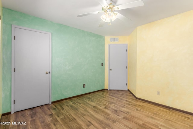 8410 E Heath Ct, Tucson, AZ 85715 - unfurnished room with wood finished floors and a ceiling fan