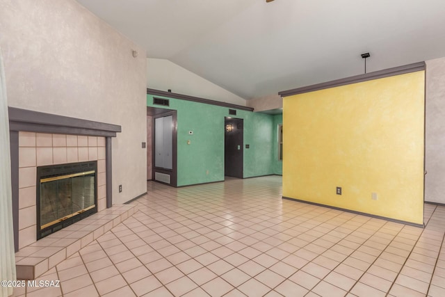 8410 E Heath Ct, Tucson, AZ 85715 - unfurnished living room featuring lofted ceiling, light tile patterned flooring, and a fireplace