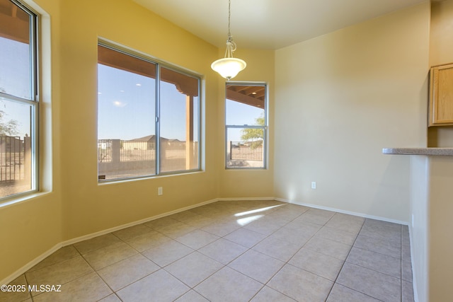 17160 W Starr Rd, Marana, AZ 85653 - unfurnished dining area with light tile patterned floors and baseboards