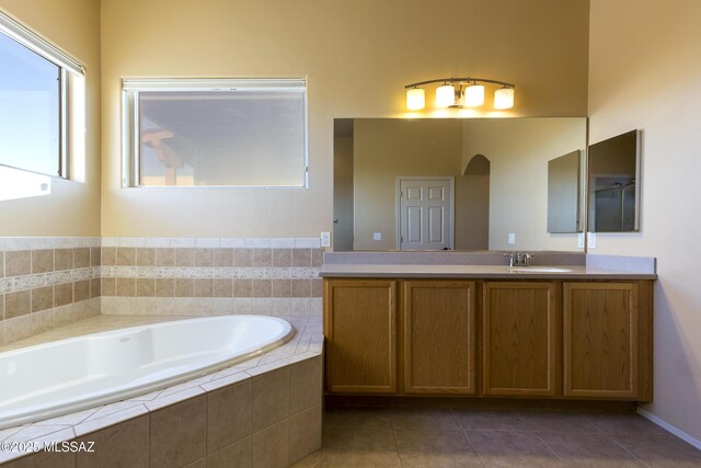 17160 W Starr Rd, Marana, AZ 85653 - bathroom with a garden tub, vanity, and tile patterned flooring