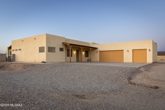17160 W Starr Rd, Marana, AZ 85653 - adobe home featuring driveway, a garage, and stucco siding