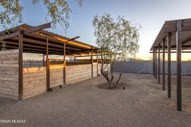 17160 W Starr Rd, Marana, AZ 85653 - yard at dusk featuring an exterior structure and an outdoor structure
