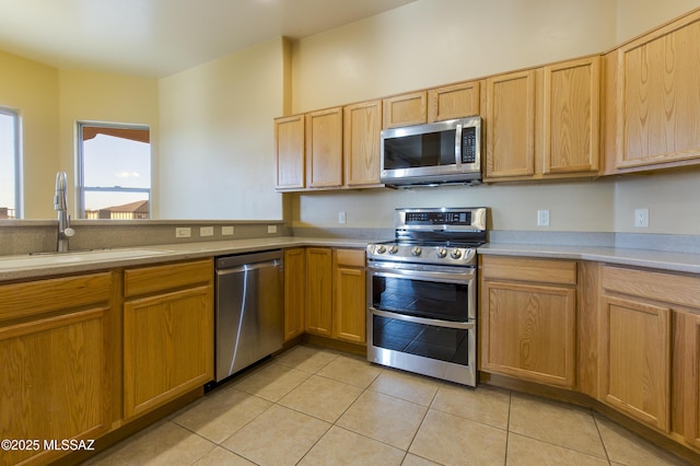 17160 W Starr Rd, Marana, AZ 85653 - kitchen with appliances with stainless steel finishes, light tile patterned floors, and light countertops