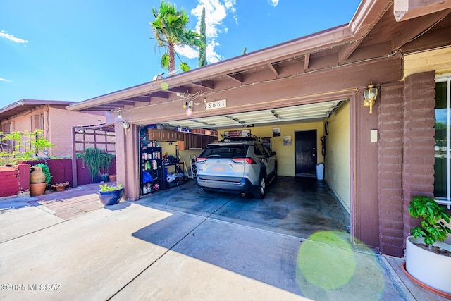 8681 E Desert Palm St, Tucson, AZ 85730 - view of vehicle parking with driveway and an attached garage