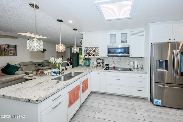 8681 E Desert Palm St, Tucson, AZ 85730 - kitchen with stainless steel appliances, a peninsula, open floor plan, white cabinets, and recessed lighting