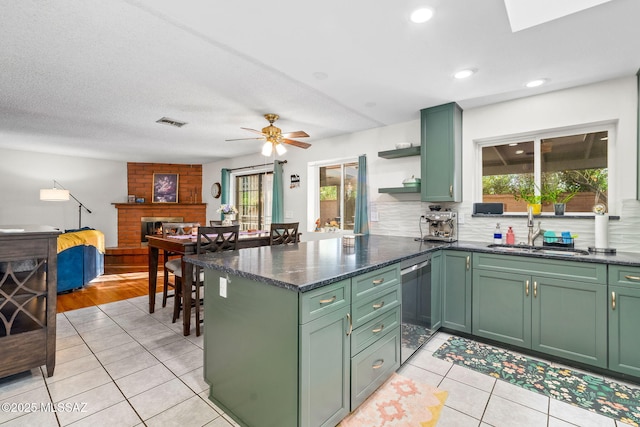 53 N Davila Cir, Tucson, AZ 85745 - kitchen featuring green cabinets, stainless steel dishwasher, healthy amount of natural light, and recessed lighting
