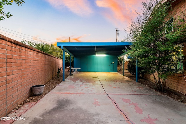 53 N Davila Cir, Tucson, AZ 85745 - view of patio / terrace featuring concrete driveway and a carport