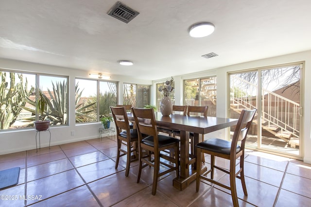 2856 W Goldfield Dr, Tucson, AZ 85745 - tiled dining room featuring healthy amount of natural light