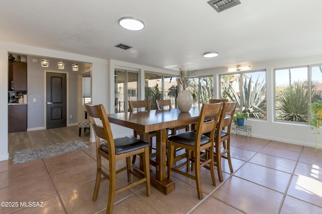 2856 W Goldfield Dr, Tucson, AZ 85745 - dining area with light tile patterned floors and baseboards