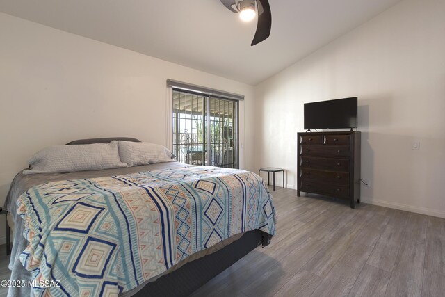 2856 W Goldfield Dr, Tucson, AZ 85745 - bedroom featuring lofted ceiling, wood finished floors, and a ceiling fan