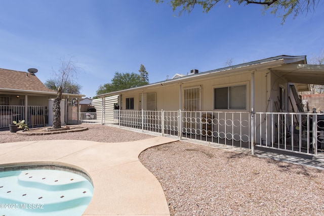 2856 W Goldfield Dr, Tucson, AZ 85745 - rear view of house with a patio and an outdoor pool