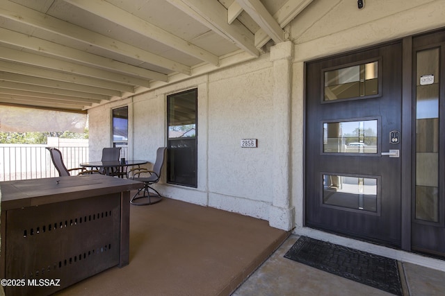 2856 W Goldfield Dr, Tucson, AZ 85745 - doorway to property featuring stucco siding and covered porch