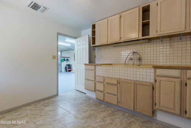 2856 W Goldfield Dr, Tucson, AZ 85745 - kitchen with open shelves, decorative backsplash, and light brown cabinets