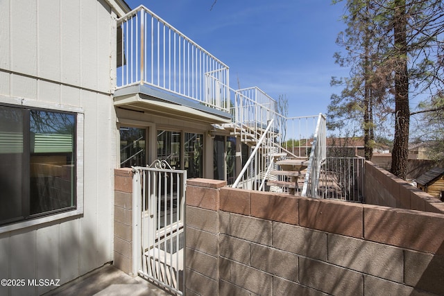 2856 W Goldfield Dr, Tucson, AZ 85745 - view of side of property featuring stairway, a gate, and a balcony