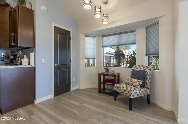 2856 W Goldfield Dr, Tucson, AZ 85745 - sitting room with light wood-type flooring and vaulted ceiling