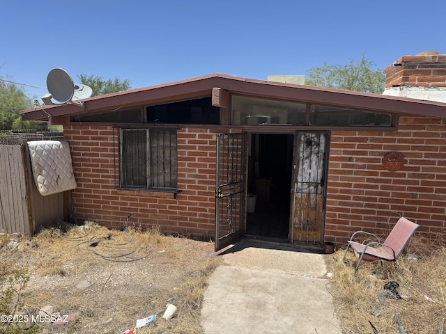 206 W Blacklidge Dr, Tucson, AZ 85705 - view of exterior entry with brick siding