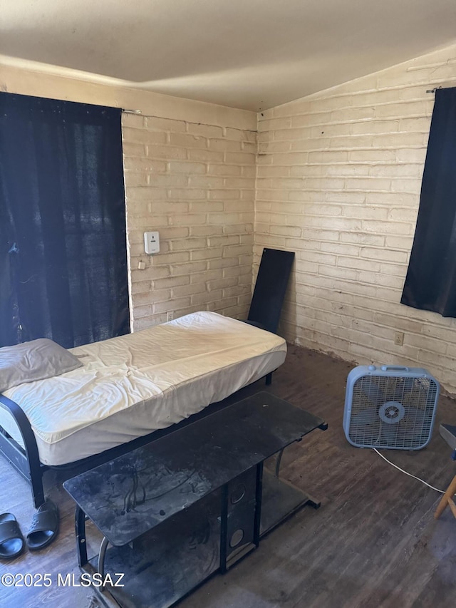 206 W Blacklidge Dr, Tucson, AZ 85705 - bedroom featuring wood finished floors and brick wall