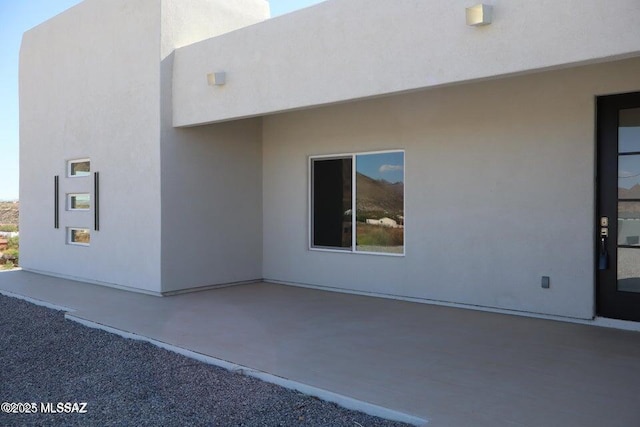 1886 Via Francia, Rio Rico, AZ 85648 - view of property exterior with stucco siding and a patio area