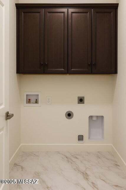 1886 Via Francia, Rio Rico, AZ 85648 - laundry room with cabinet space, light marble finish flooring, hookup for an electric dryer, hookup for a washing machine, and gas dryer hookup