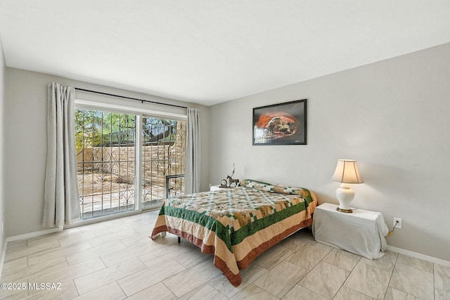 4211 N Villas Placitas, Tucson, AZ 85705 - bedroom with access to outside and baseboards