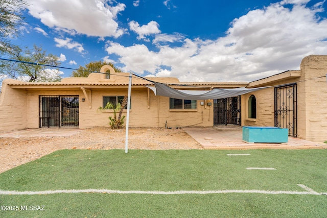 4211 N Villas Placitas, Tucson, AZ 85705 - back of house with a patio and a yard