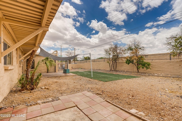 4211 N Villas Placitas, Tucson, AZ 85705 - fenced backyard with a patio area and a putting area