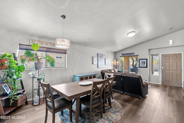 8035 S Talaco Trl, Tucson, AZ 85756 - dining area featuring wood finished floors and lofted ceiling