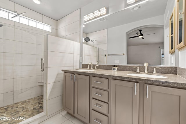 8035 S Talaco Trl, Tucson, AZ 85756 - full bathroom with tiled shower, double vanity, ceiling fan, and tile patterned floors