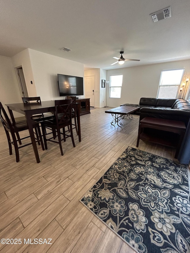 1126 E Descent St, Tucson, AZ 85719 - living area with light wood-style floors and ceiling fan