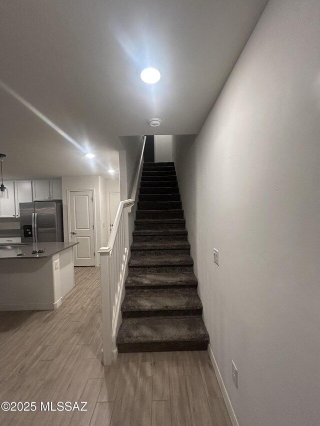 1126 E Descent St, Tucson, AZ 85719 - stairs featuring wood finished floors