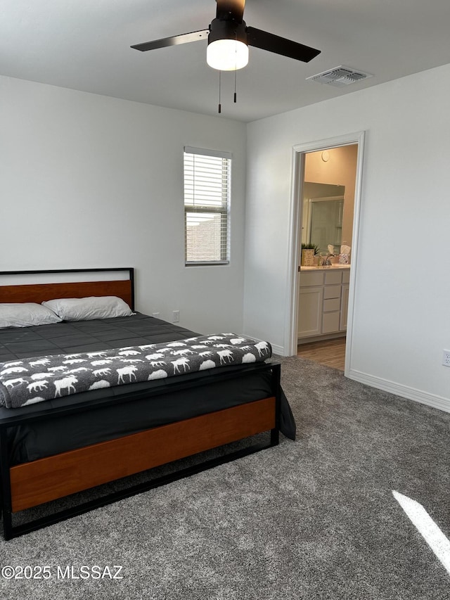 1126 E Descent St, Tucson, AZ 85719 - bedroom featuring carpet flooring, connected bathroom, and a ceiling fan